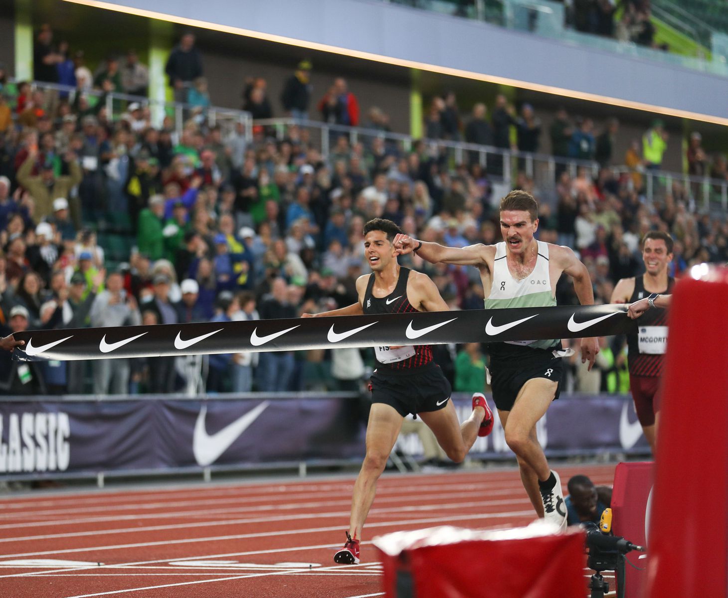 Joe Klecker (right) edges Grant Fisher of the Bowerman Track Club to win the USA Track & Field men's 10,000-meter championship race on Friday, May 27, 2022, in the Prefontaine Classic at Hayward Field in Eugene. Klecker and Fisher earned spots on Team USA for the World Athletics Championships in July at Hayward Field.