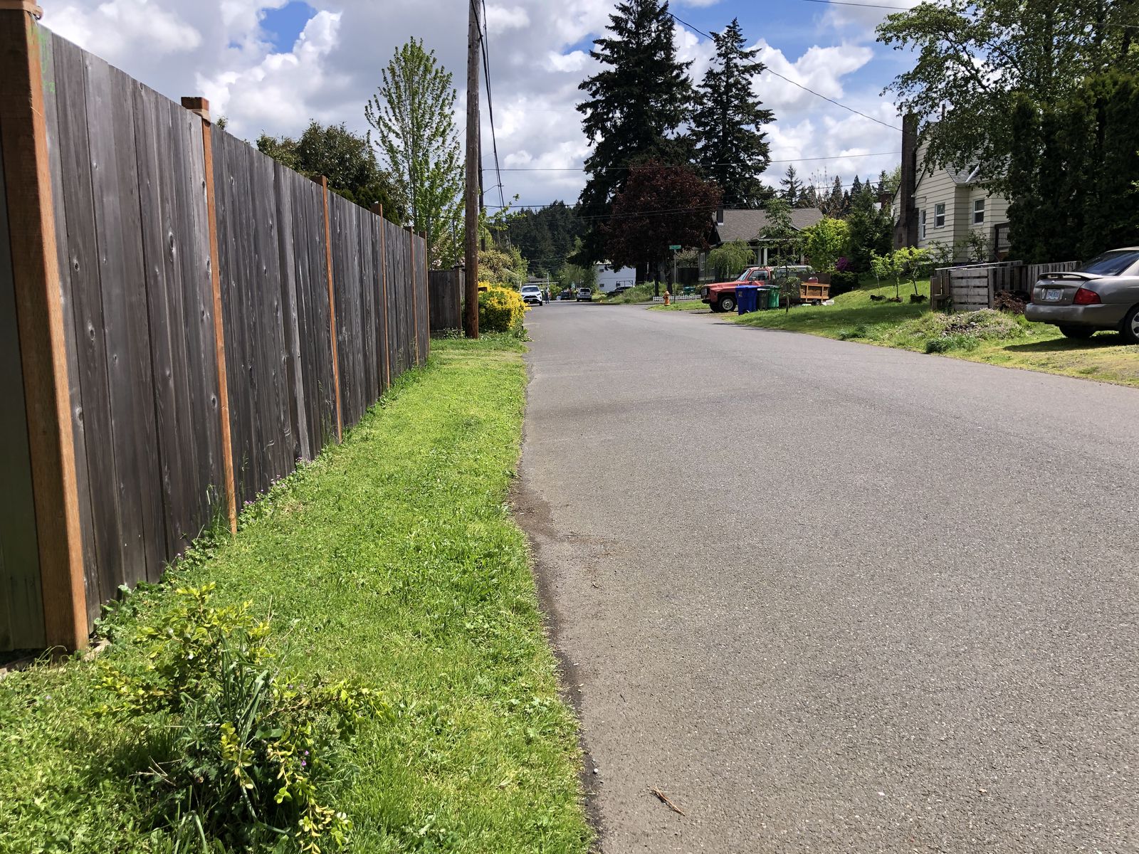 The stretch of Northeast Mason Street, between 78th and 79th avenues, where the shooting occurred. Police had pulled over a silver Lexus, which came to a stop on the side of the road near this fence, facing west toward 78th Avenue, residents said.