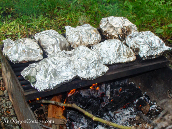 Cooking Chicken Foil Dinner packets at campsite