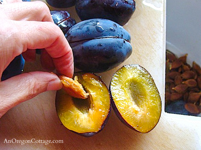 removing pits from cut plums