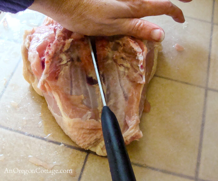 cutting whole chicken-separating the breasts