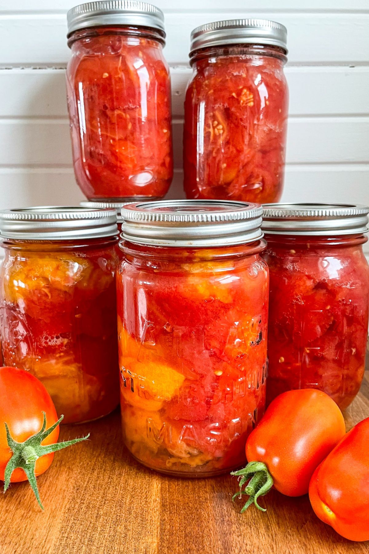 jars of diced canned roasted tomatoes with tomatoes