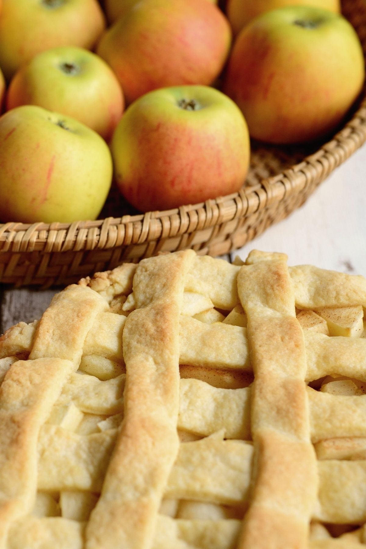 bowl of apples with lattice topped pie