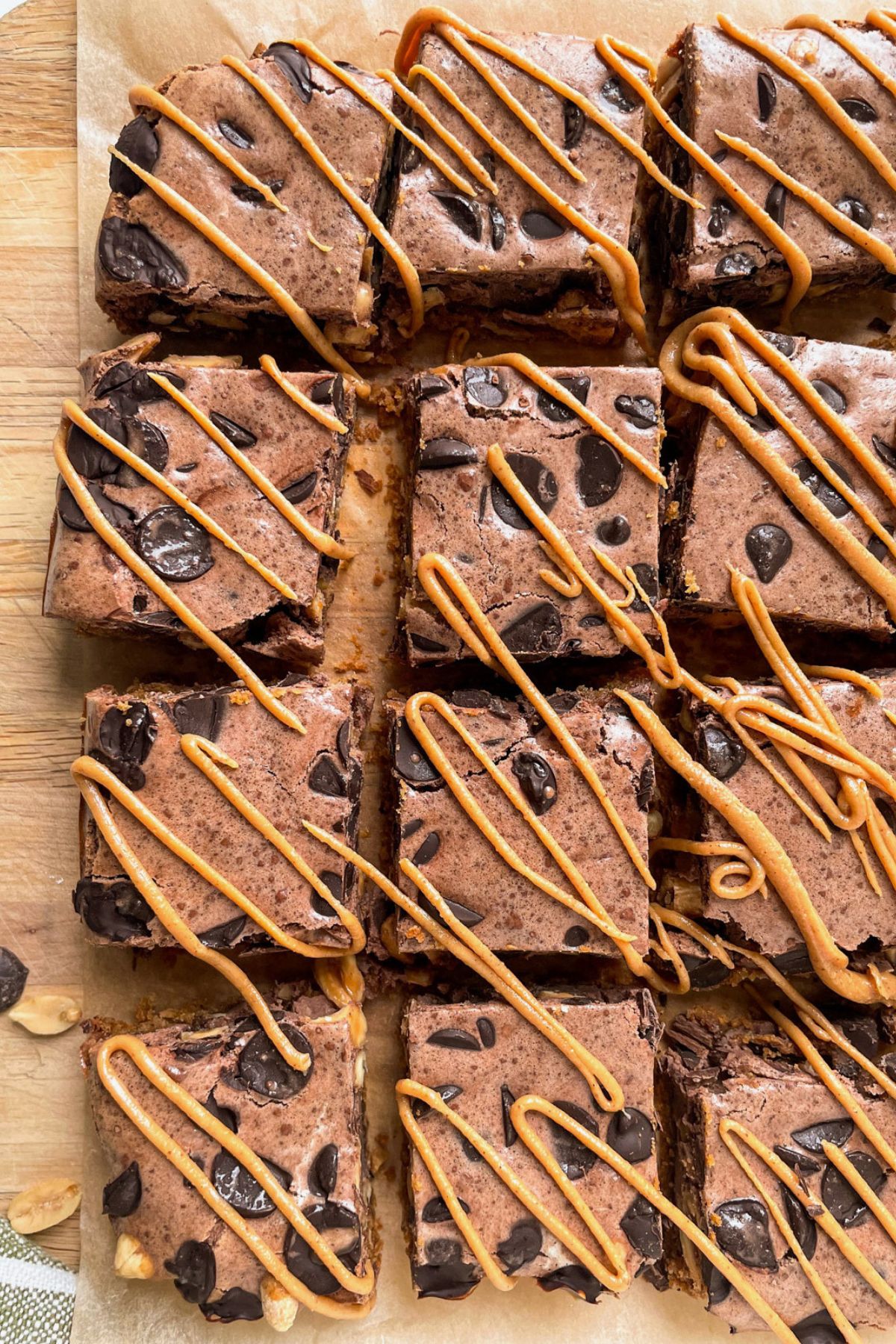 layered chocolate peanut butter bars cut above